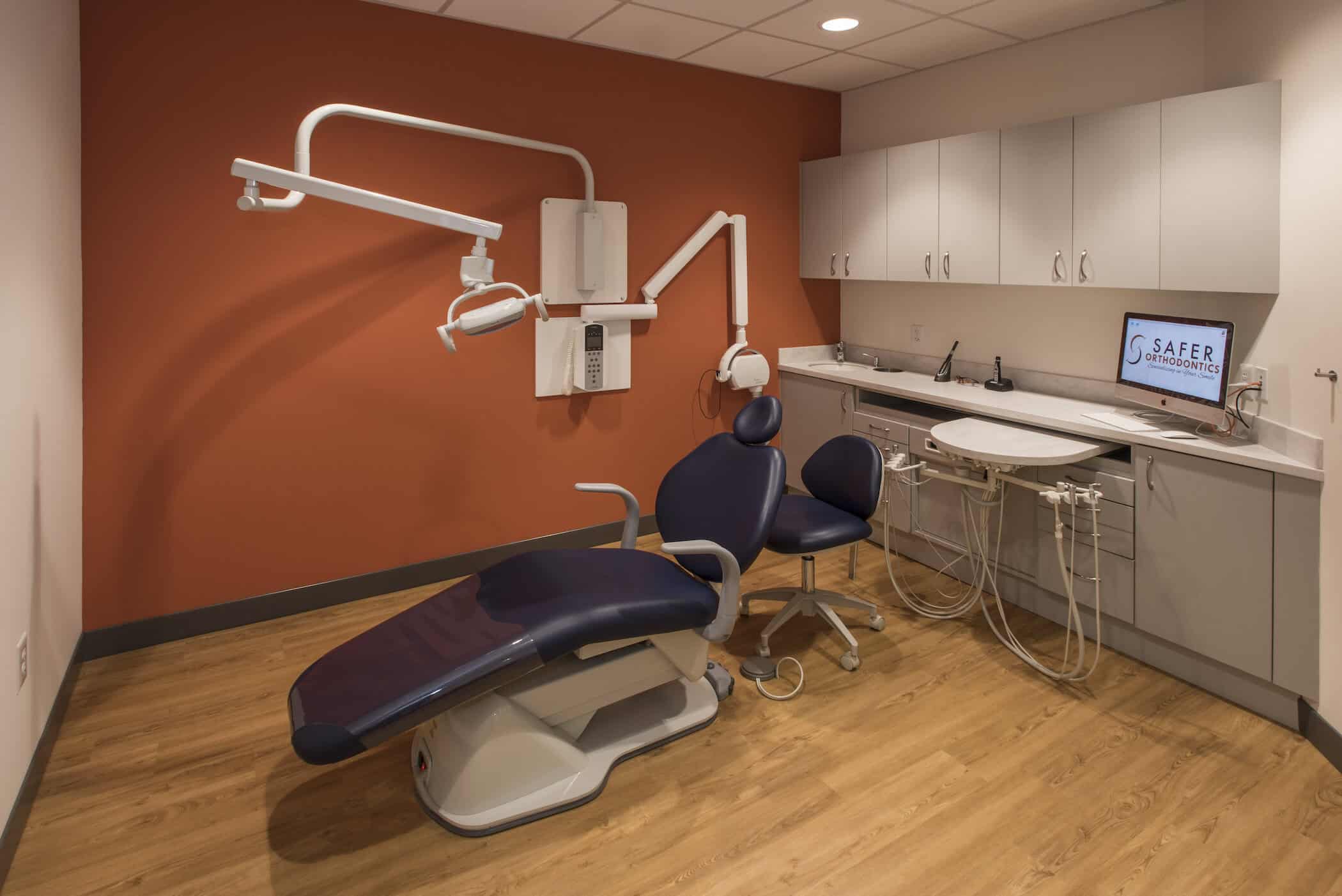 Dental office with chair and equipment.